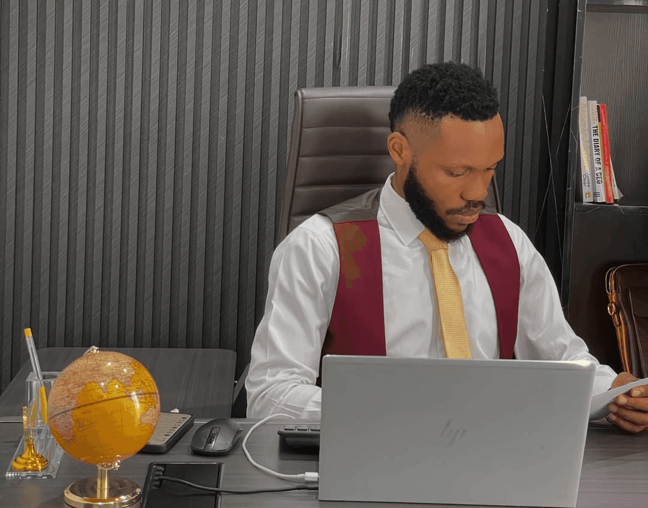 Joshua Johnson, founder of Eljey Enterprise, working at his desk